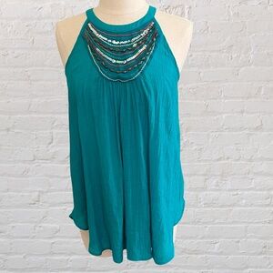 Teal halter top with beaded neckline and chest area from IZ BYER